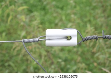 Illustrative example of ceramic electric fence insulator invented from Google Search